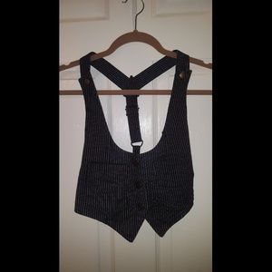 Black vest with thin white stripes.